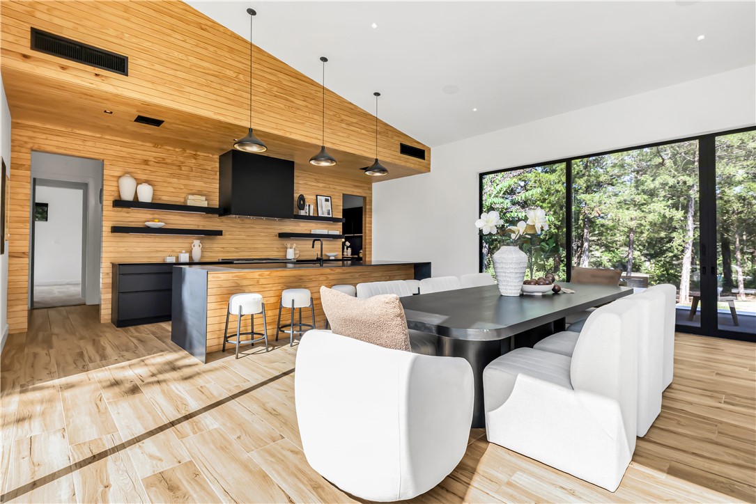 11851 Hopes Creek Road College Station, TX 77845 - Photo 12 of 50 a living room with fireplace furniture and a floor to ceiling window