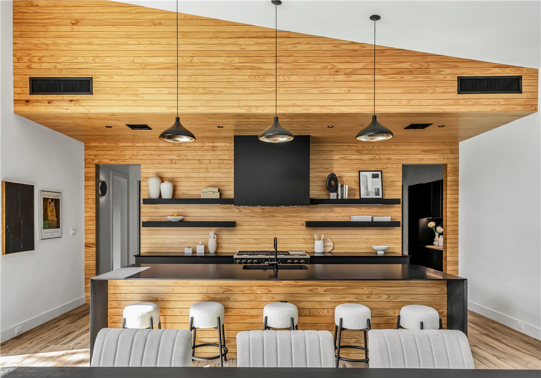 11851 Hopes Creek Road College Station, TX 77845 - Photo 15 of 50 a kitchen with stainless steel appliances granite countertop a sink and wooden cabinets