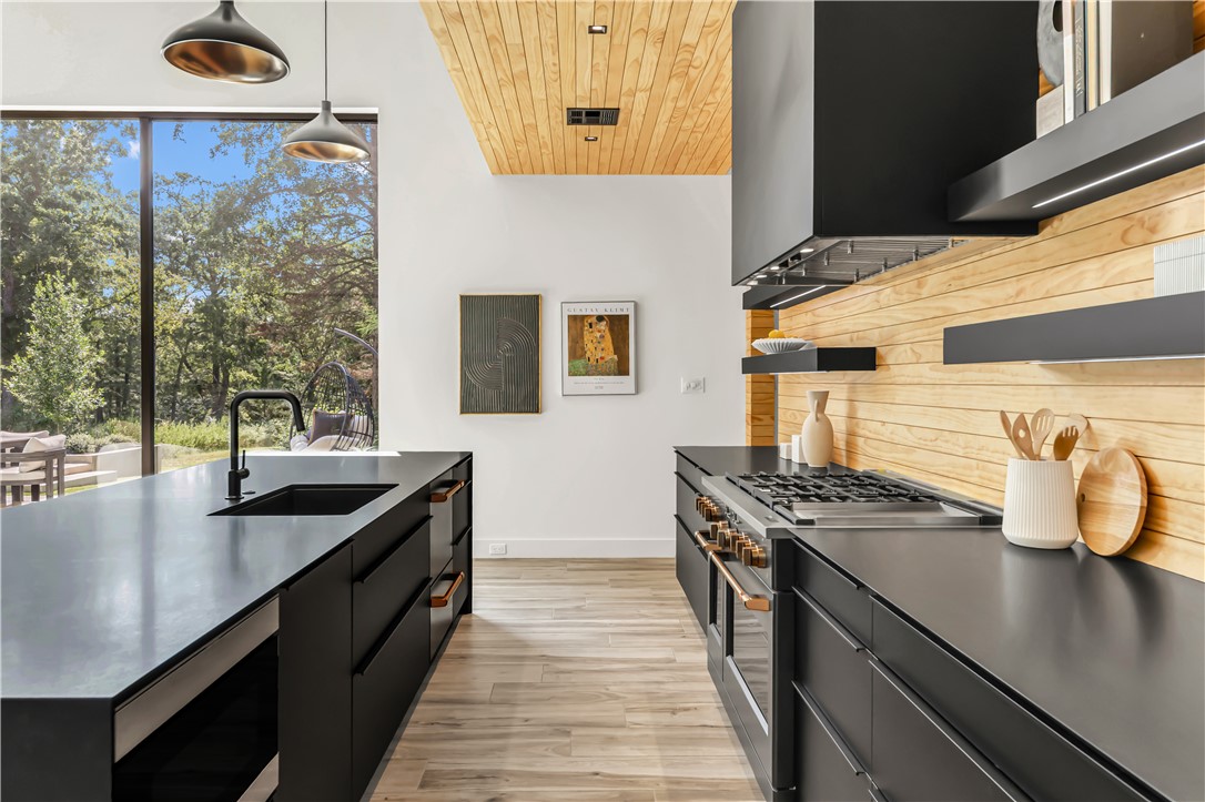 11851 Hopes Creek Road College Station, TX 77845 - Photo 18 of 50 a kitchen with stainless steel appliances granite countertop a sink and a stove