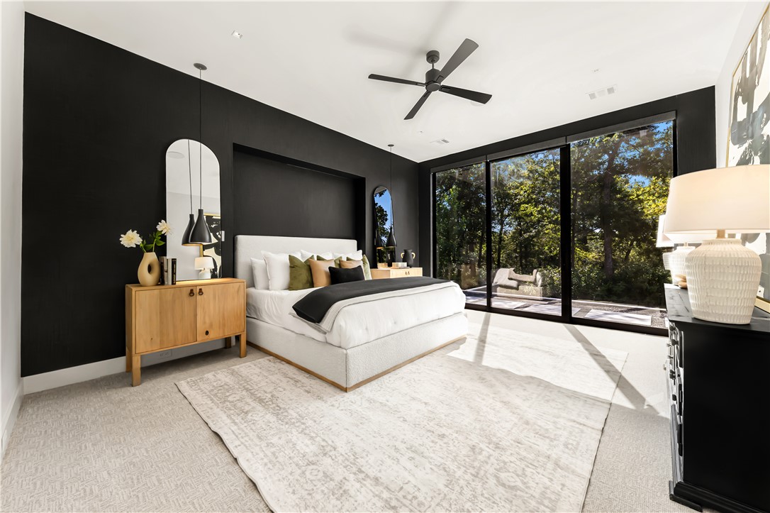 11851 Hopes Creek Road College Station, TX 77845 - Photo 24 of 50 a bedroom with a bed wooden floor and large window