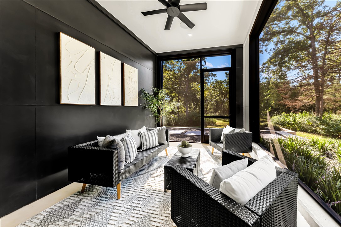 11851 Hopes Creek Road College Station, TX 77845 - Photo 32 of 50 a living room with furniture and a floor to ceiling window