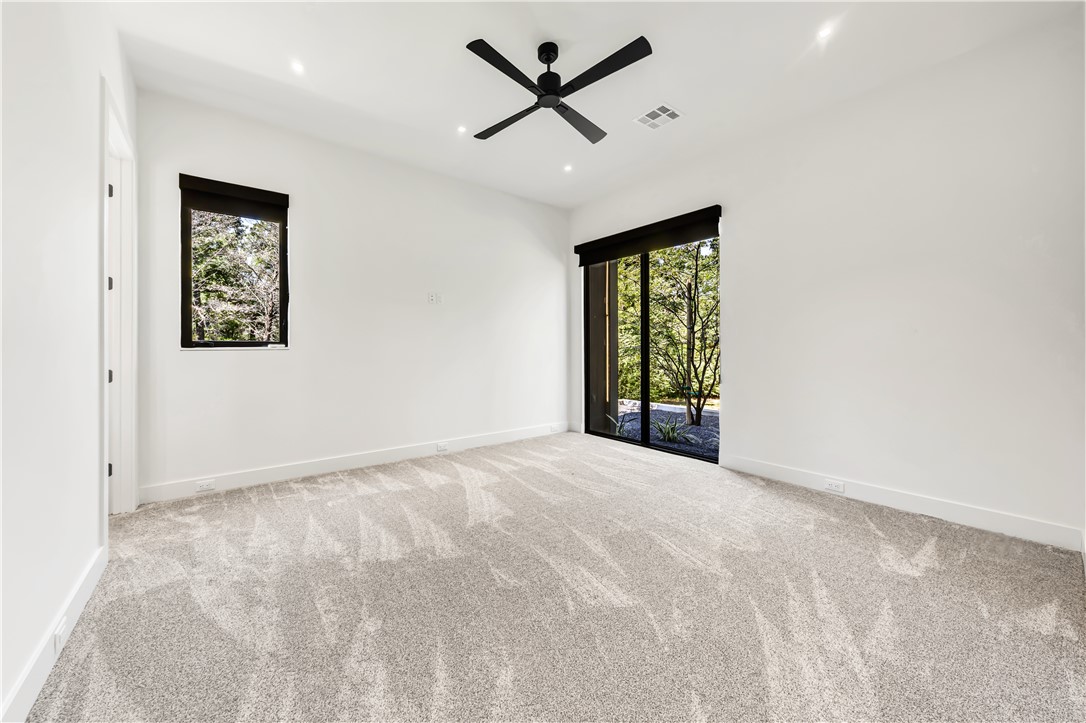 11851 Hopes Creek Road College Station, TX 77845 - Photo 36 of 50 an empty room with windows and fan