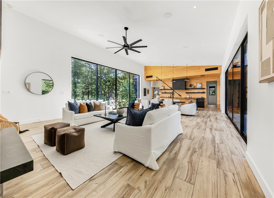 11851 Hopes Creek Road College Station, TX 77845 - Photo 10 of 50 a living room with patio furniture and a wooden floor