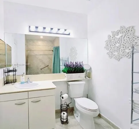 a bathroom with a shower and a bath tub