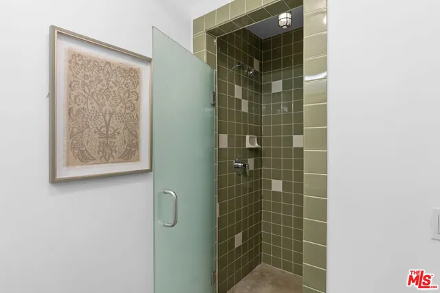 a bedroom with furniture and wooden floor