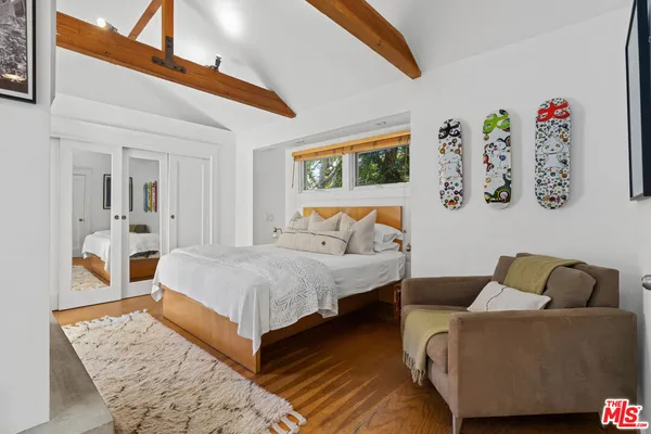a bedroom with a bed and a fireplace