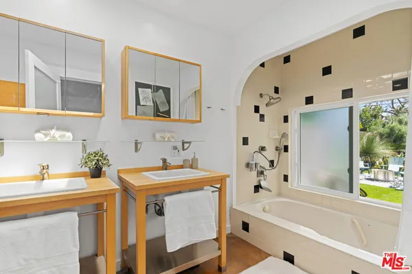 a utility room with sink dryer and washer