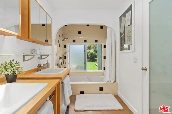 a view of a chair and table in the garden