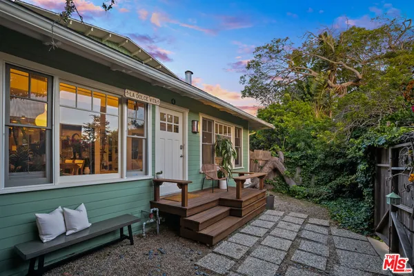 a front view of a house with a porch
