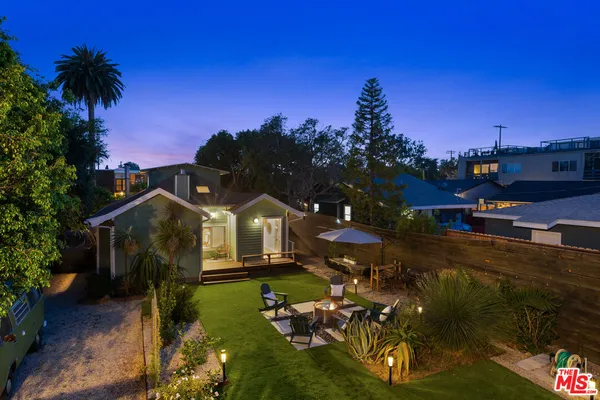 a view of a house with a yard porch and sitting area