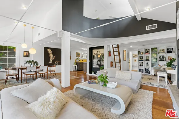 a living room with furniture and a table