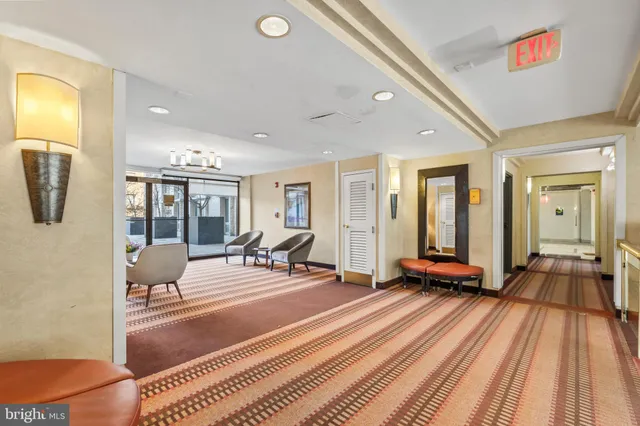 a living room with furniture and a rug