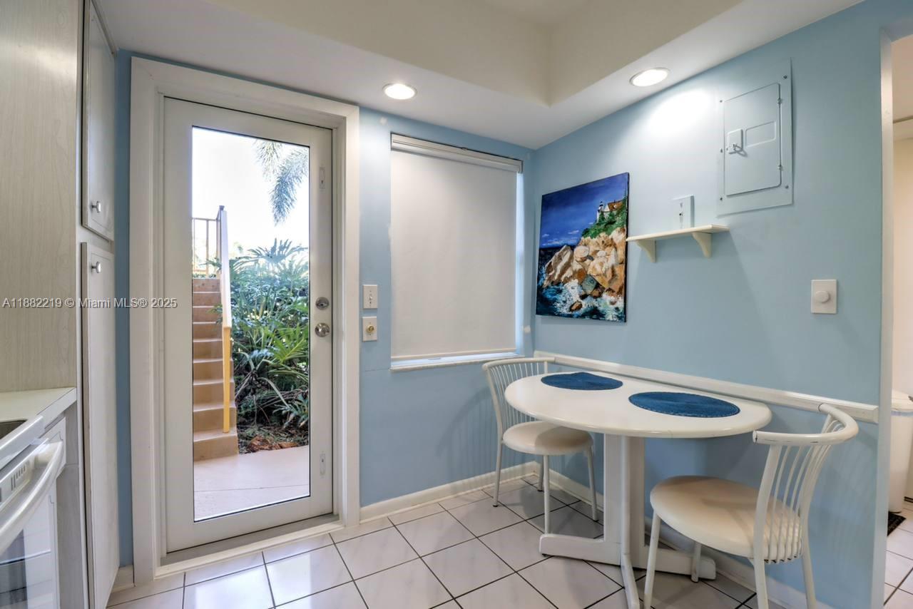 850 Northeast 12th Avenue, Unit 210 Hallandale Beach, FL 33009 - Photo 7 of 16 a view of a dining room with furniture and a potted plant