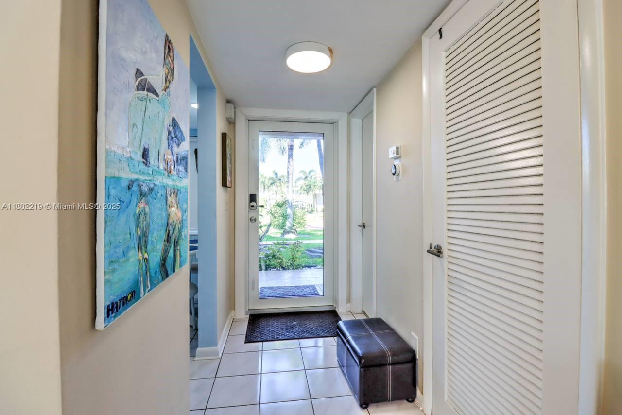850 Northeast 12th Avenue, Unit 210 Hallandale Beach, FL 33009 - Photo 9 of 16 a view of entryway with wooden floor