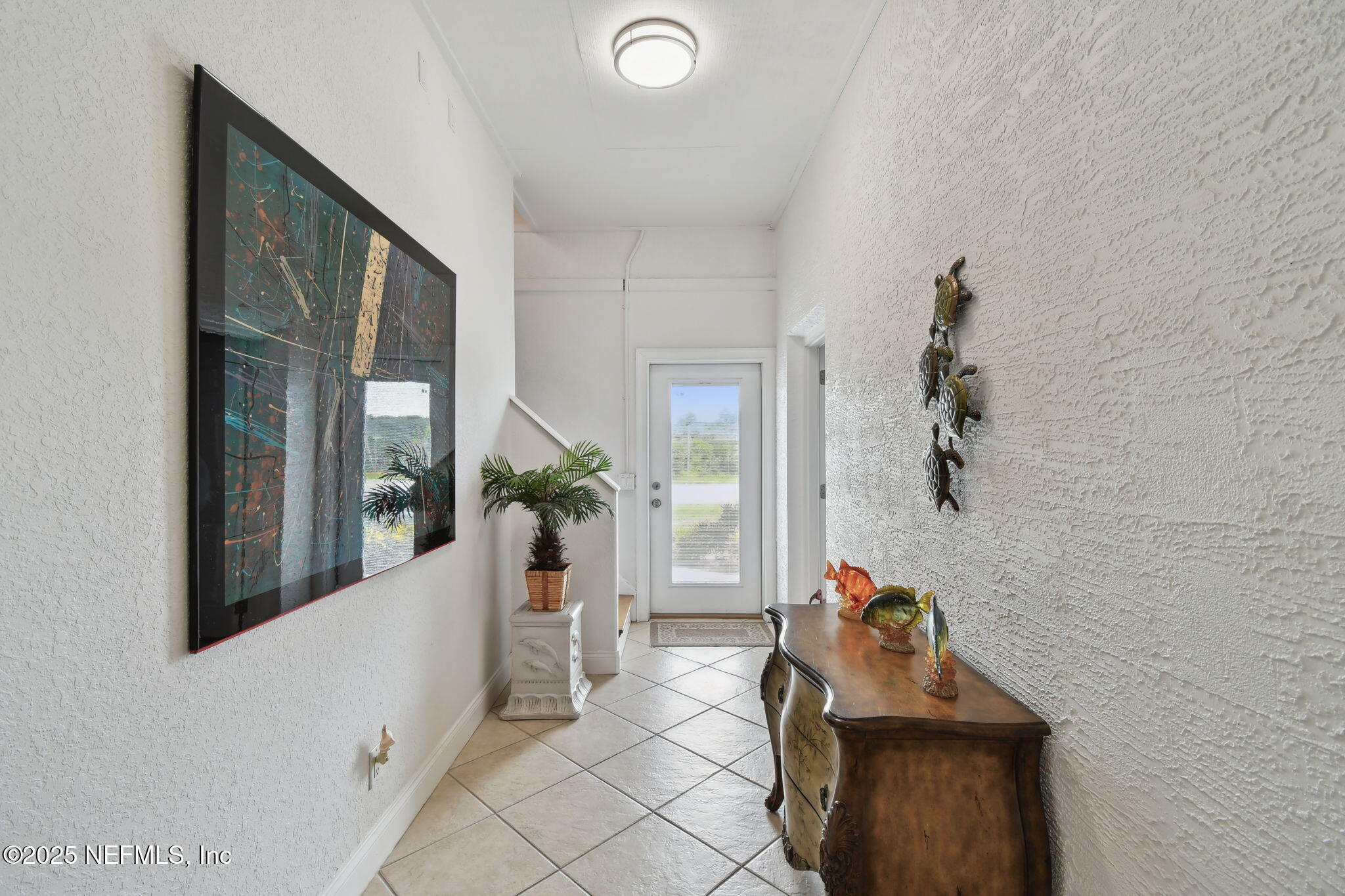 8961 A1A South St. Augustine, FL 32080 - Photo 13 of 62 a living room with furniture and a potted plant