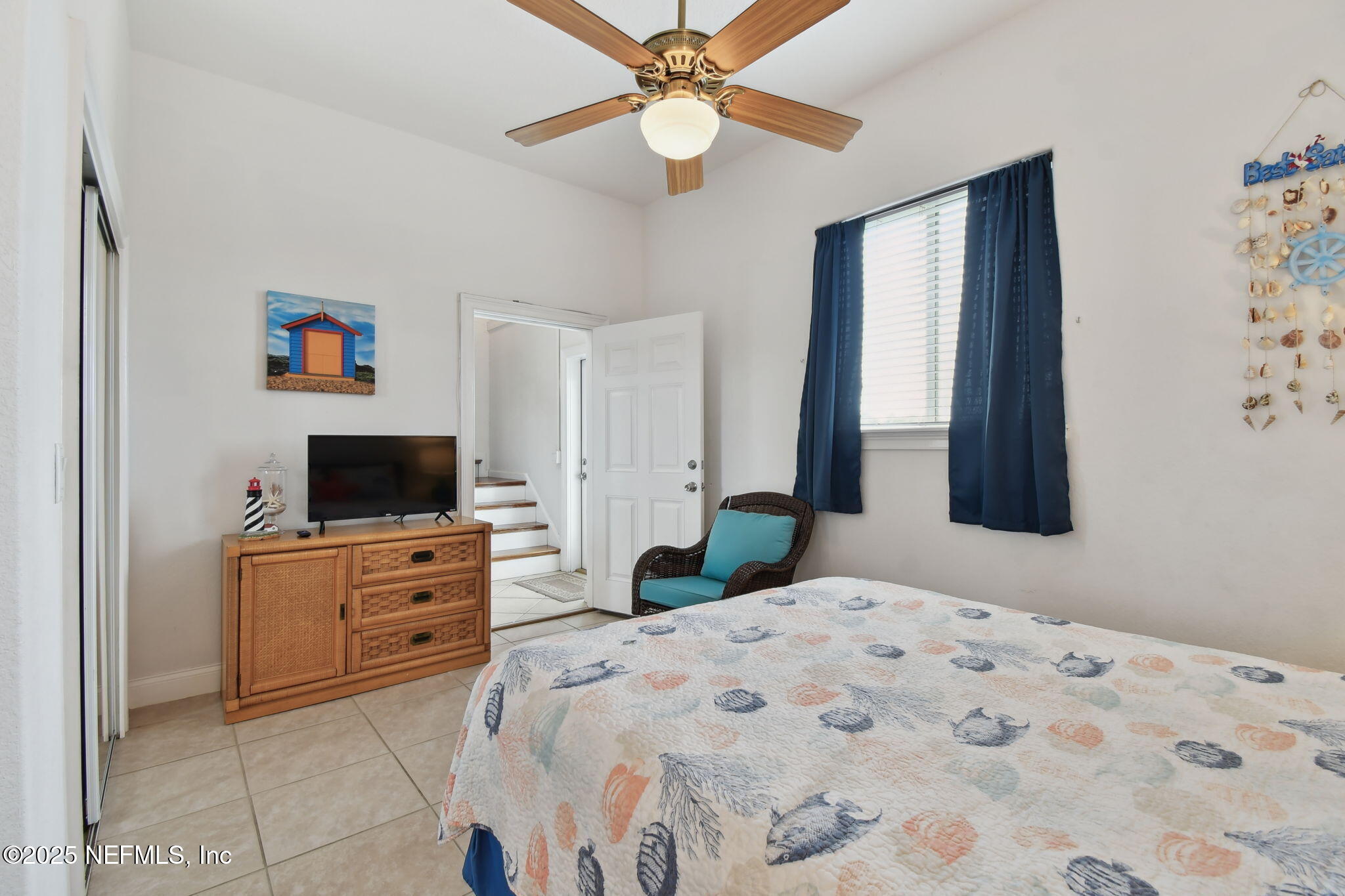 8961 A1A South St. Augustine, FL 32080 - Photo 16 of 62 a bedroom with a bed and a flat screen tv