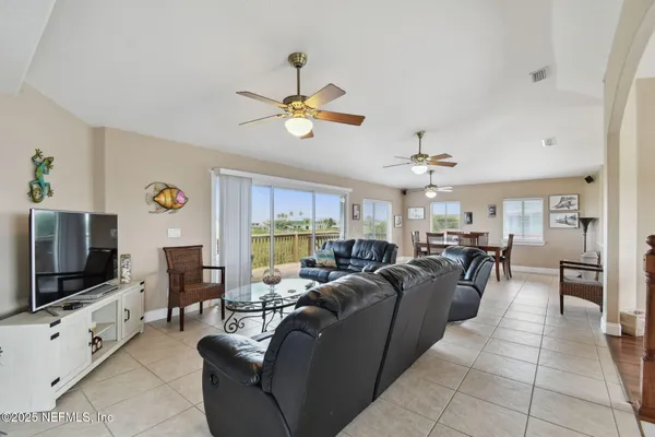 a kitchen with stainless steel appliances granite countertop a sink a stove and refrigerator