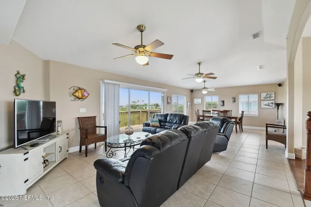 a kitchen with stainless steel appliances granite countertop a sink a stove and refrigerator