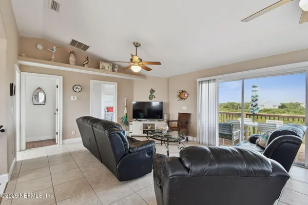 a large kitchen with stainless steel appliances granite countertop a sink refrigerator and microwave