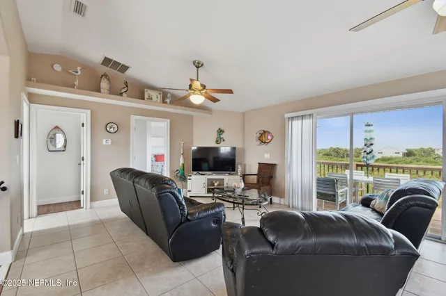 a large kitchen with stainless steel appliances granite countertop a sink refrigerator and microwave