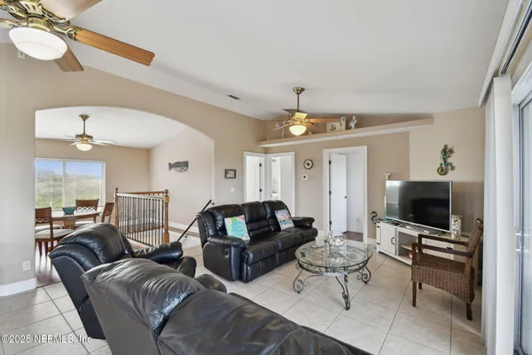 a kitchen with a table chairs sink and cabinets