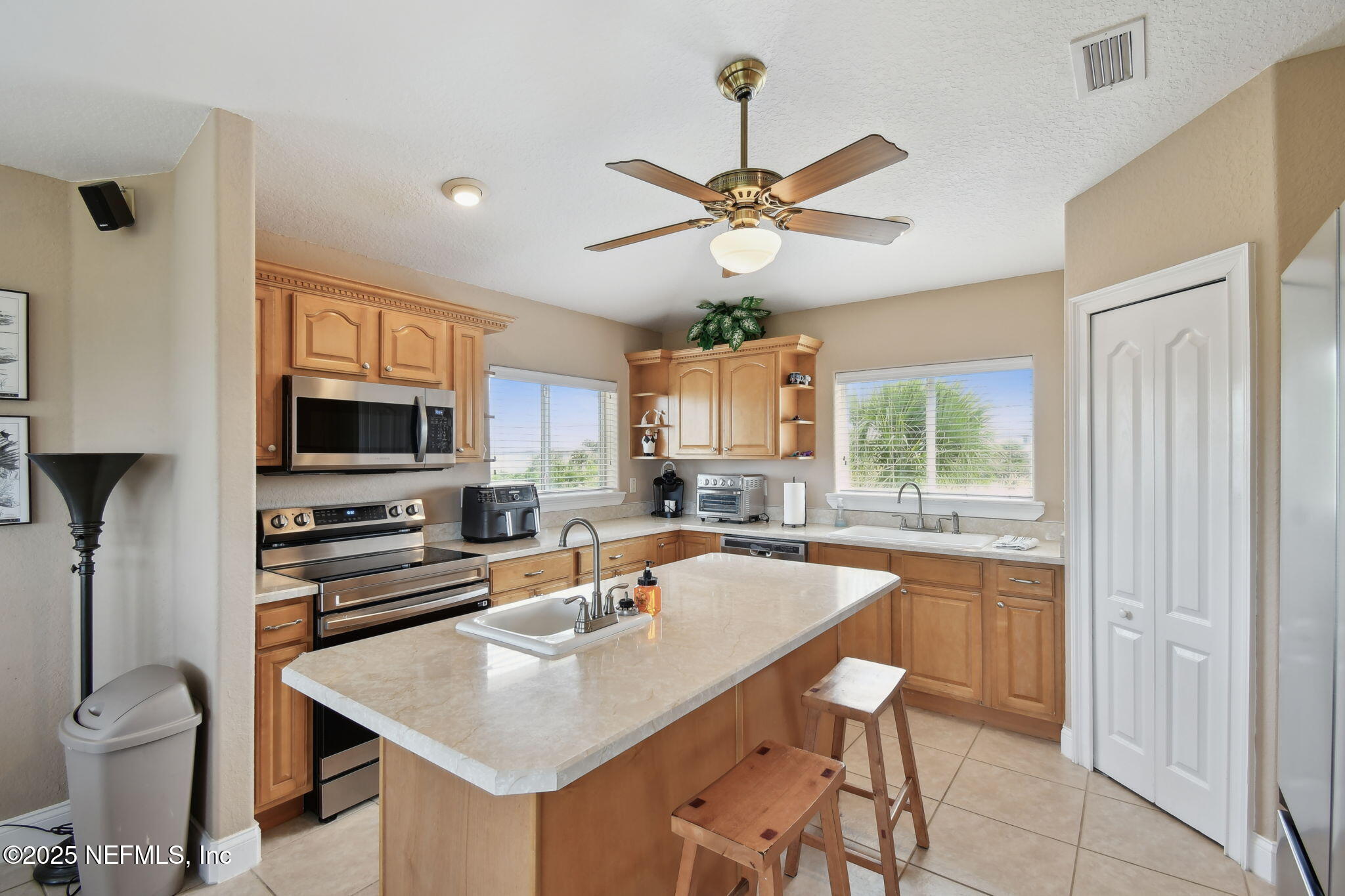 8961 A1A South St. Augustine, FL 32080 - Photo 32 of 62 a kitchen with a table chairs sink and cabinets