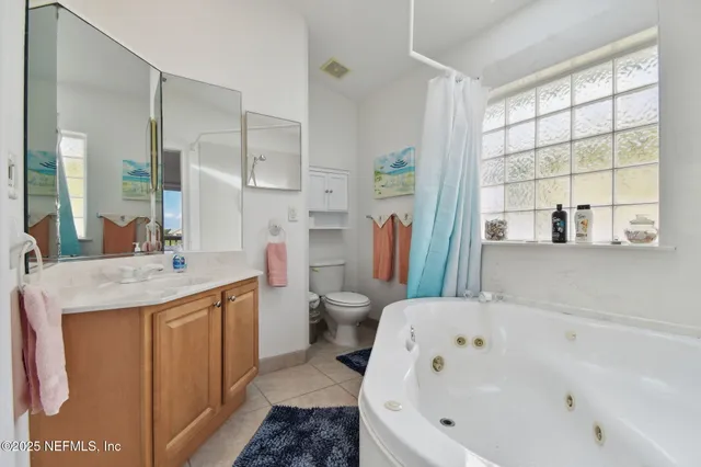 a view of a two chairs and table in the balcony