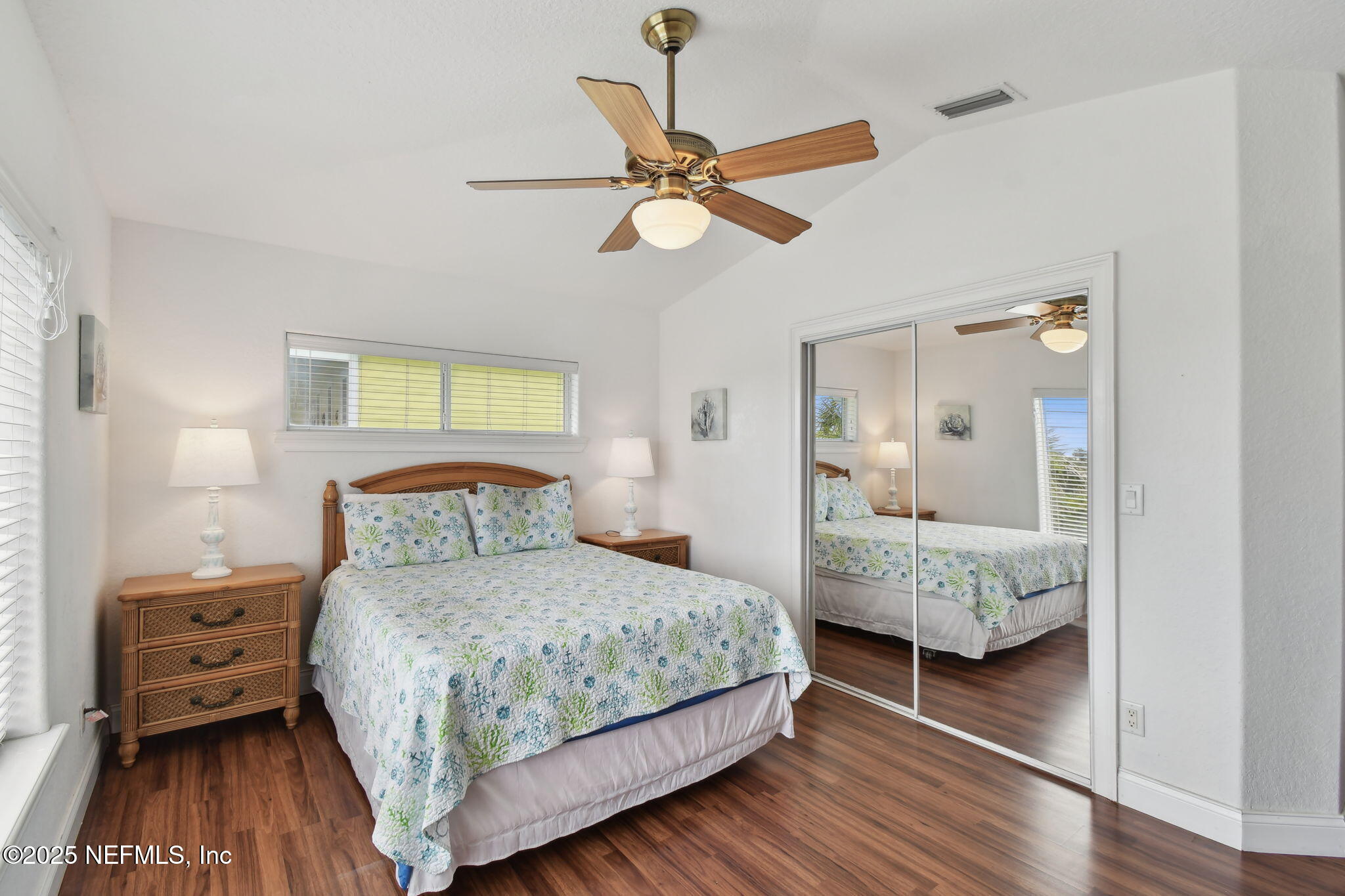 8961 A1A South St. Augustine, FL 32080 - Photo 42 of 62 a bedroom with a bed and a mirror