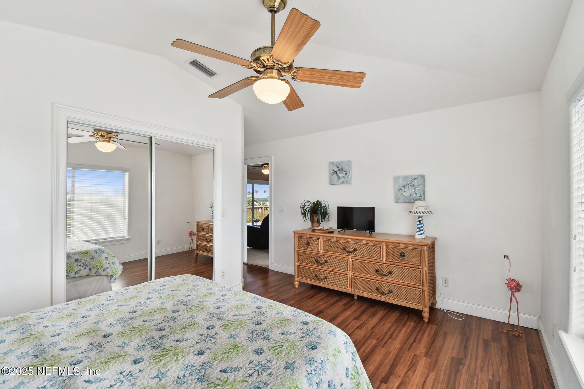 8961 A1A South St. Augustine, FL 32080 - Photo 43 of 62 a bedroom with a bed and a chandelier
