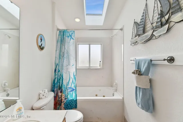 a view of a city with lush green forest