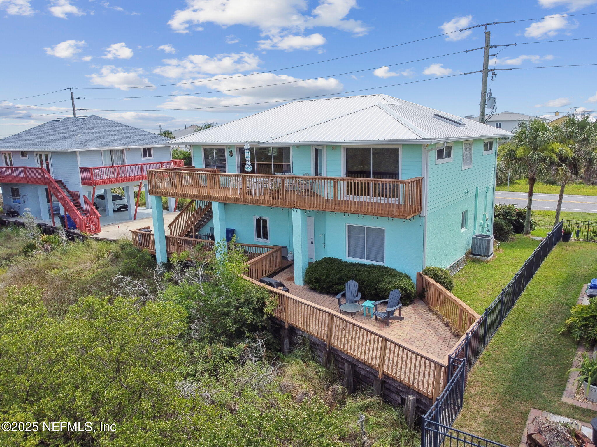 8961 A1A South St. Augustine, FL 32080 - Photo 52 of 62 a front view of a house with garden