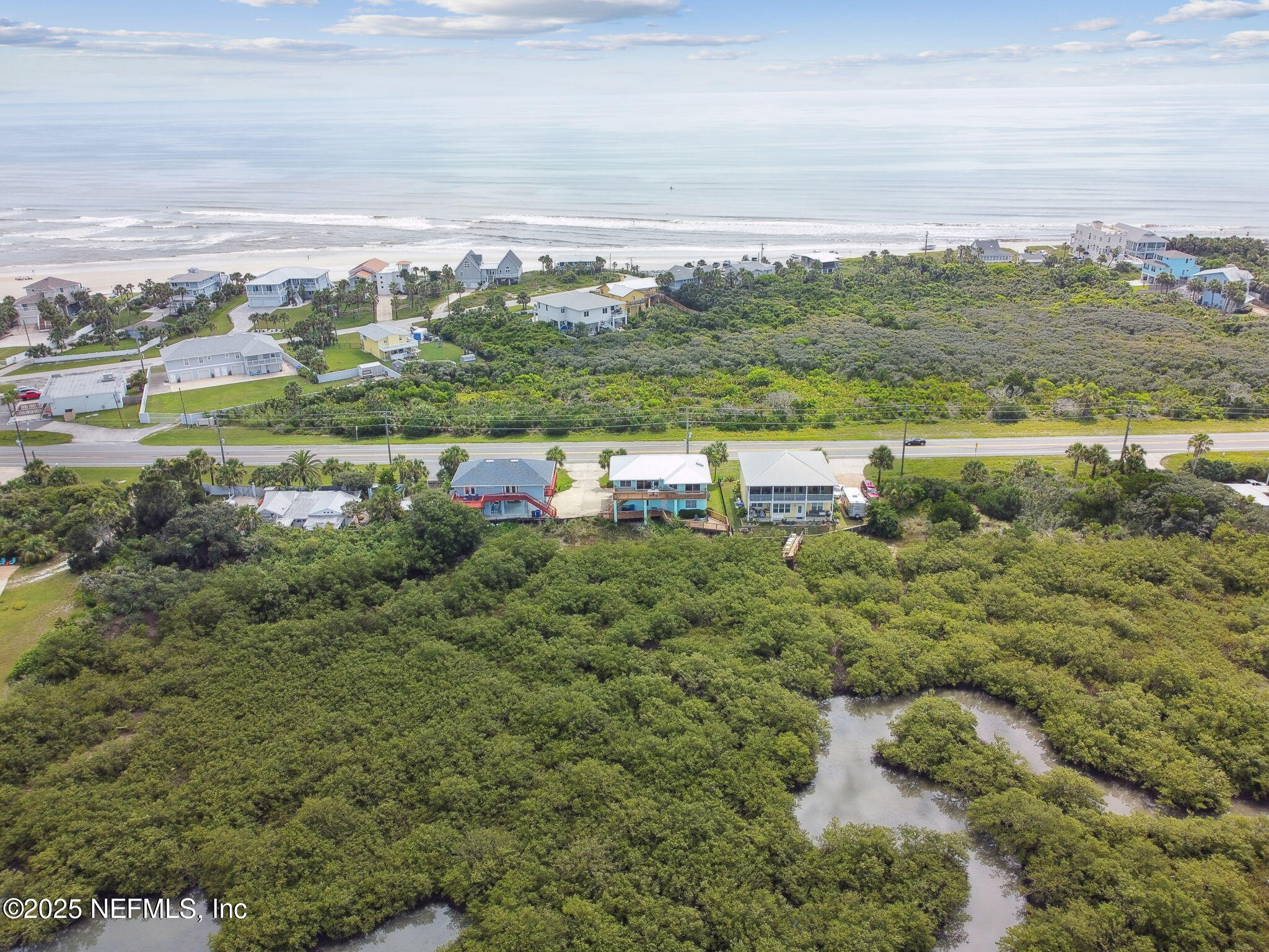 8961 A1A South St. Augustine, FL 32080 - Photo 56 of 62 a view of a city with lush green forest