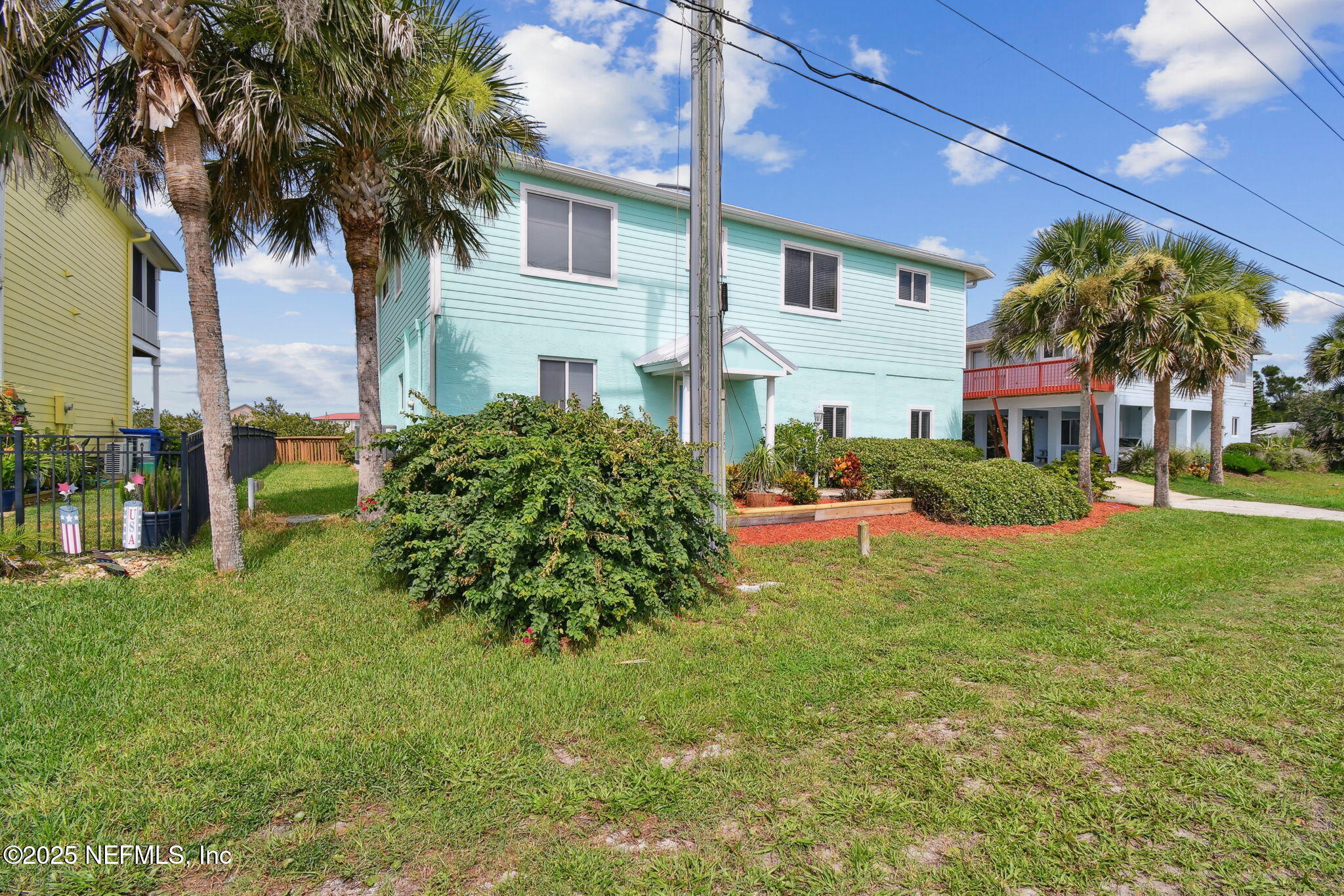 8961 A1A South St. Augustine, FL 32080 - Photo 7 of 62 a front view of a house with garden