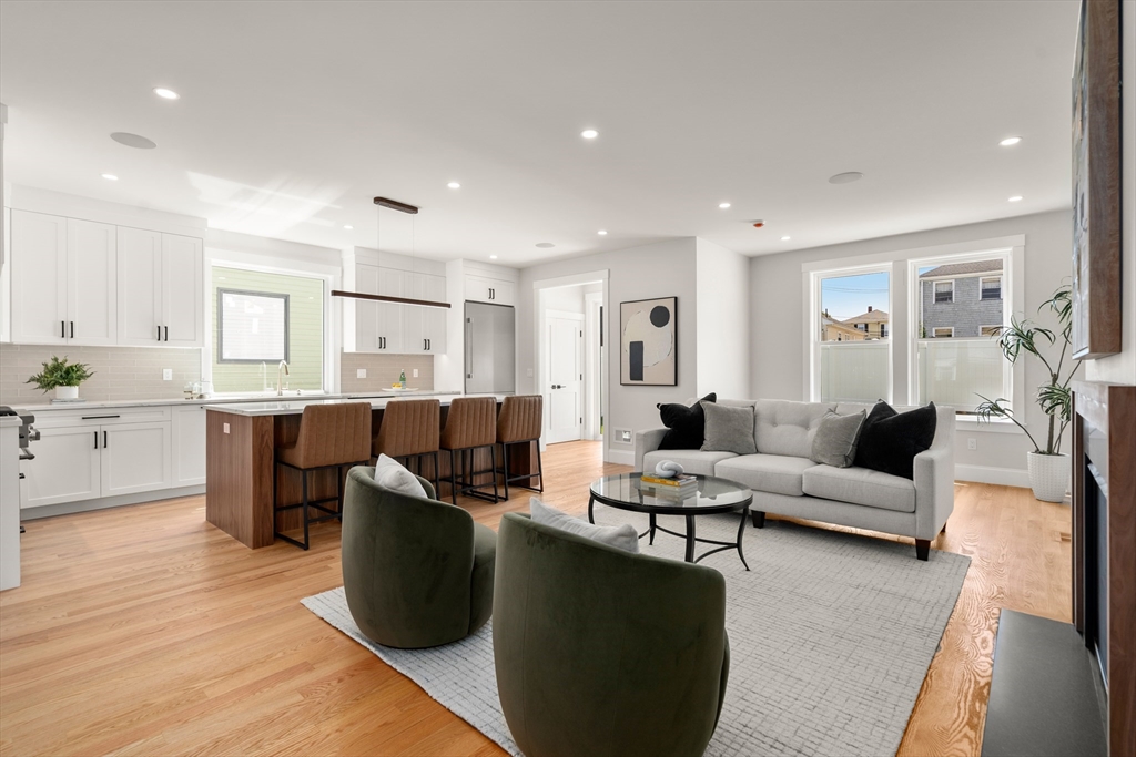 48 Hamilton Road Belmont, MA 02478 - Photo 11 of 35 a living room with furniture kitchen view and a wooden floor