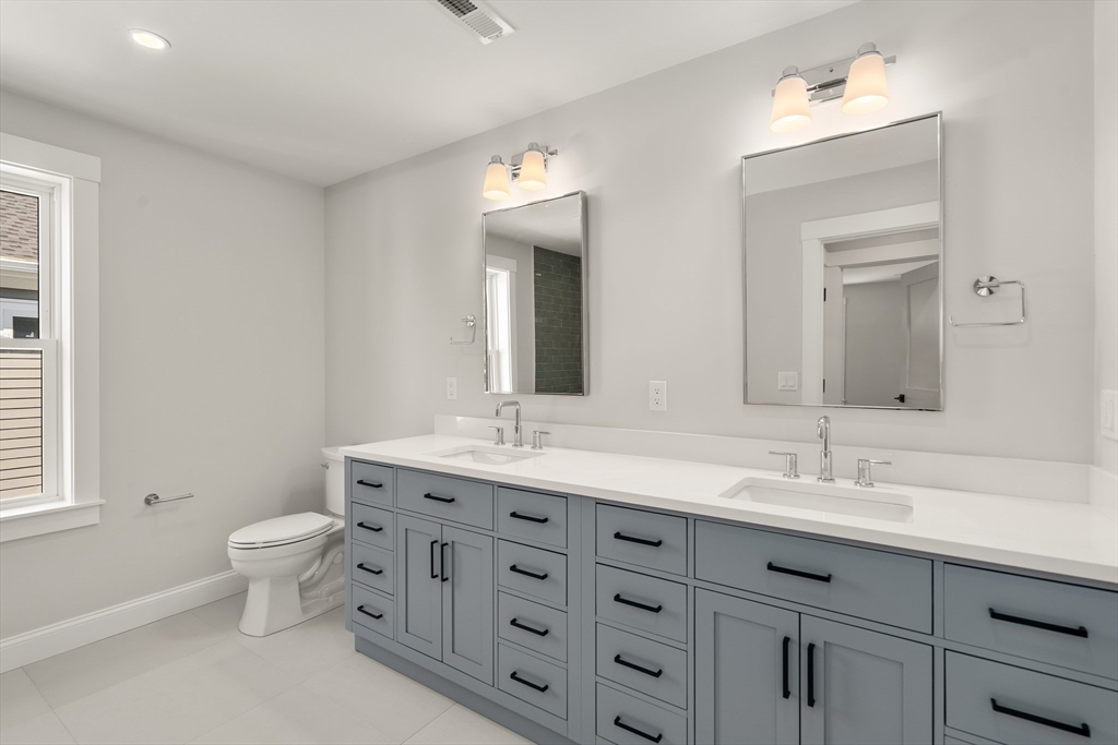 48 Hamilton Road Belmont, MA 02478 - Photo 24 of 35 a bathroom with double sink and a toilet
