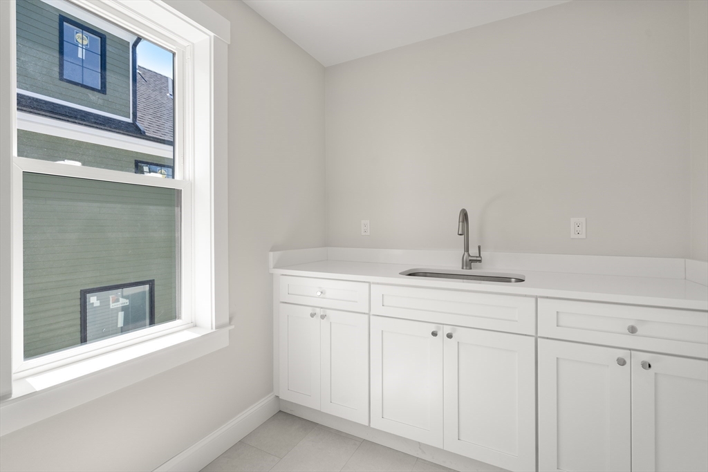 48 Hamilton Road Belmont, MA 02478 - Photo 25 of 35 a bathroom with a sink and a mirror