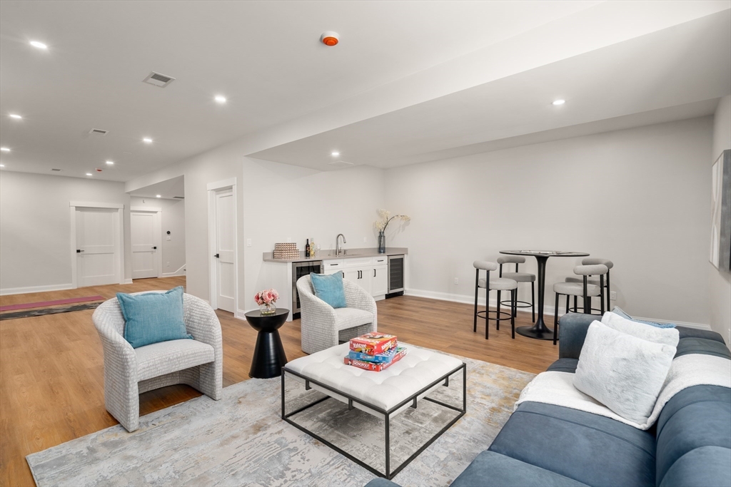 48 Hamilton Road Belmont, MA 02478 - Photo 32 of 35 a living room with furniture and a rug