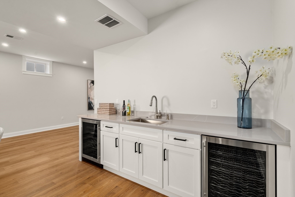 48 Hamilton Road Belmont, MA 02478 - Photo 33 of 35 a kitchen with a sink cabinets and wooden floor