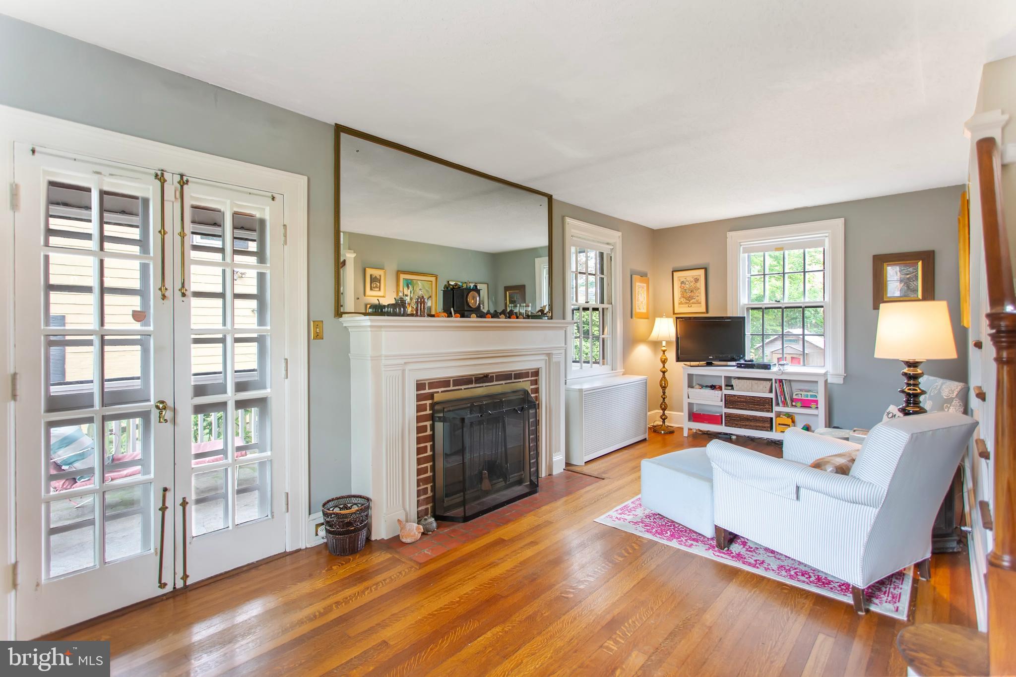 719 Brookwood Road Baltimore, MD 21229 - Photo 10 of 40 Cozy brick wood-burning fireplace