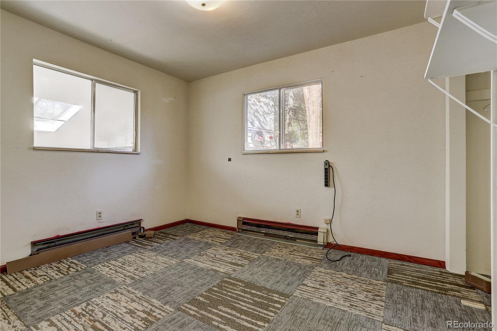 191 Anderson Road Bailey, CO 80421 - Photo 24 of 38 a view of a room with wooden floor and window
