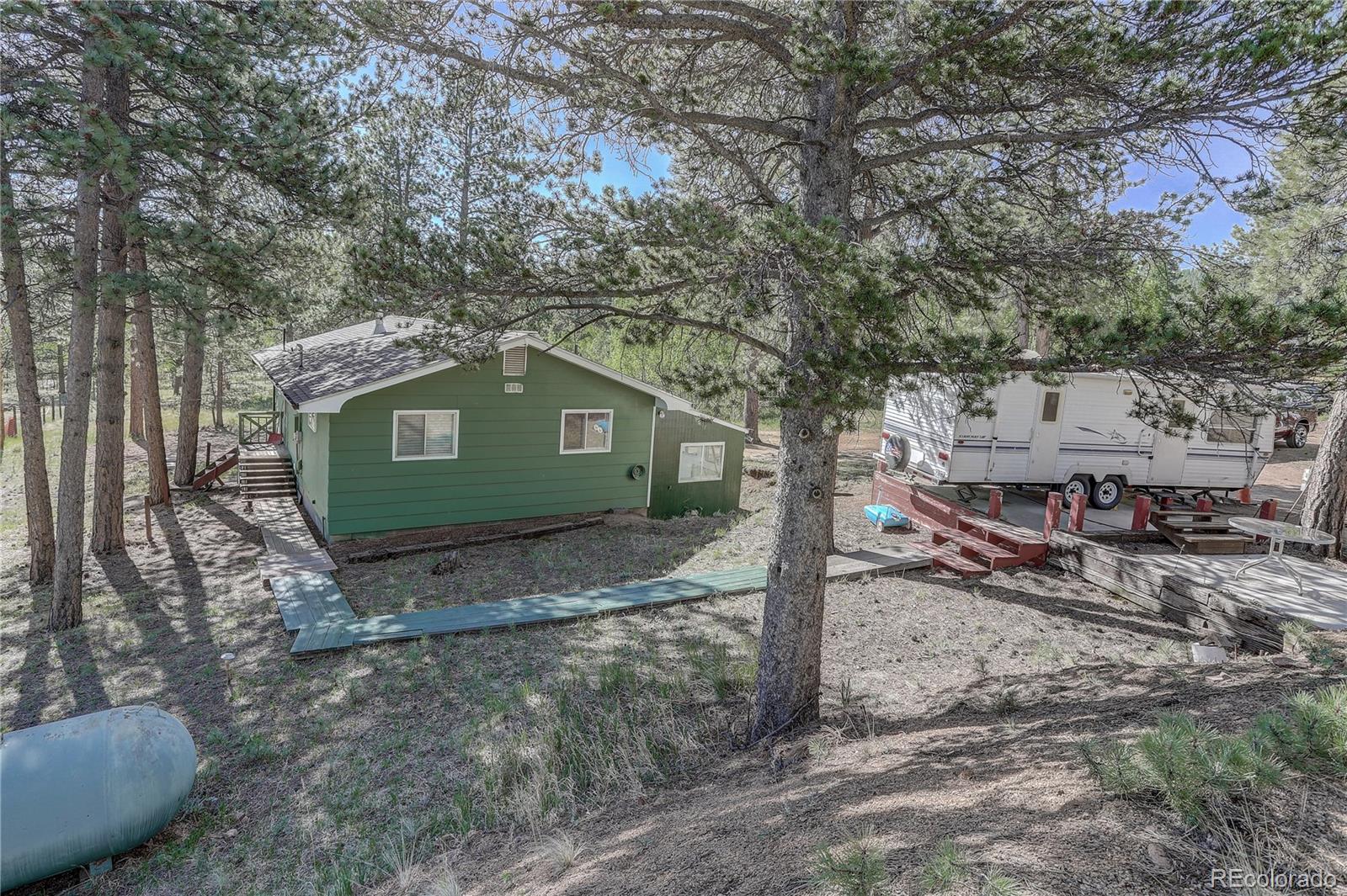 191 Anderson Road Bailey, CO 80421 - Photo 31 of 38 a view of backyard of house
