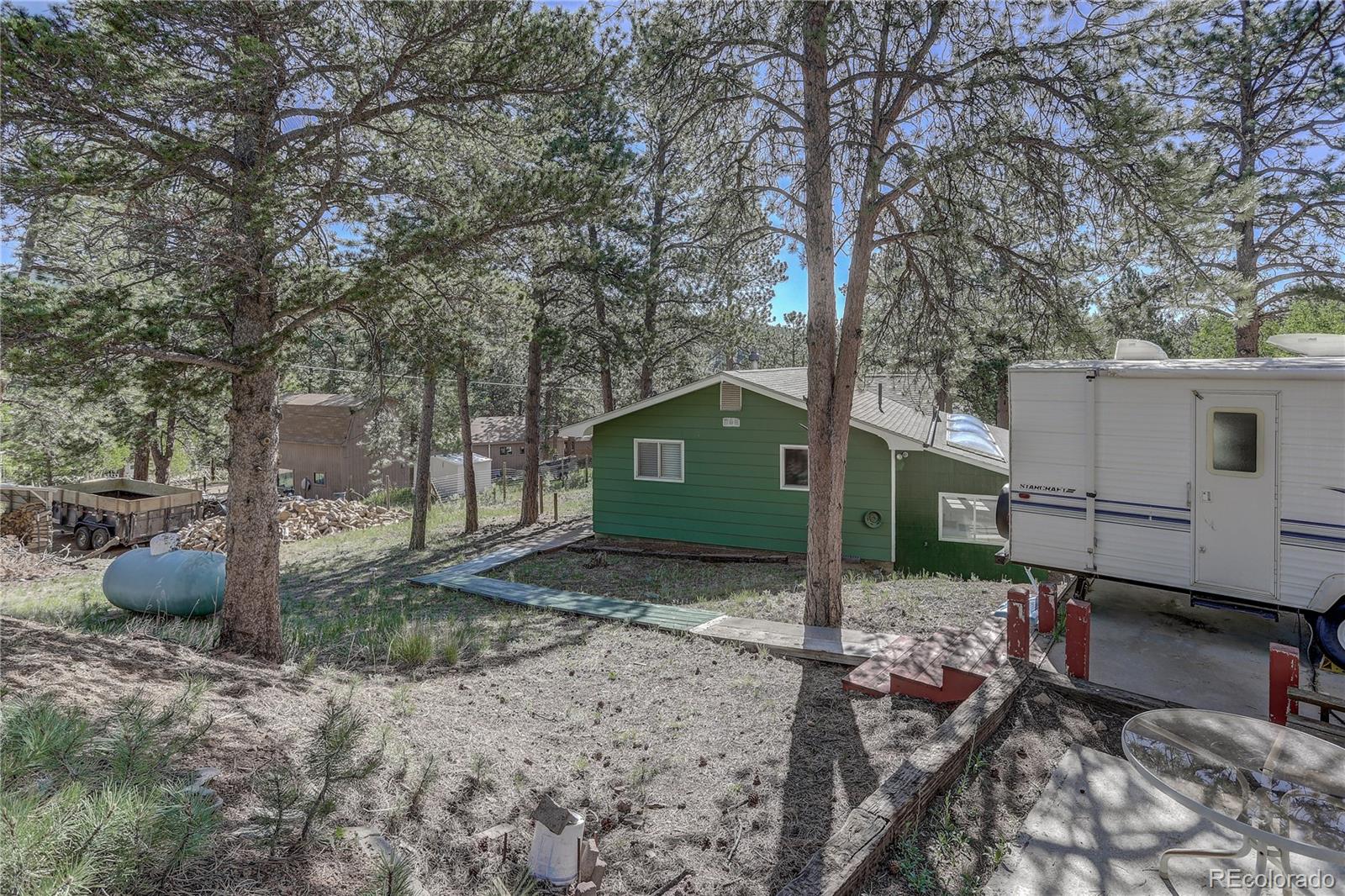 191 Anderson Road Bailey, CO 80421 - Photo 35 of 38 a view of a couches in backyard of house