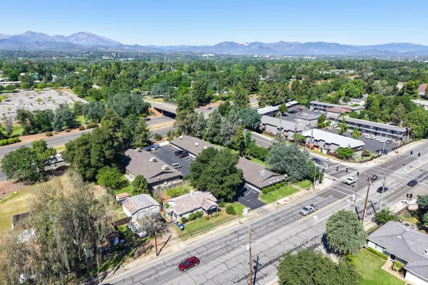 an aerial view of residential houses and outdoor space