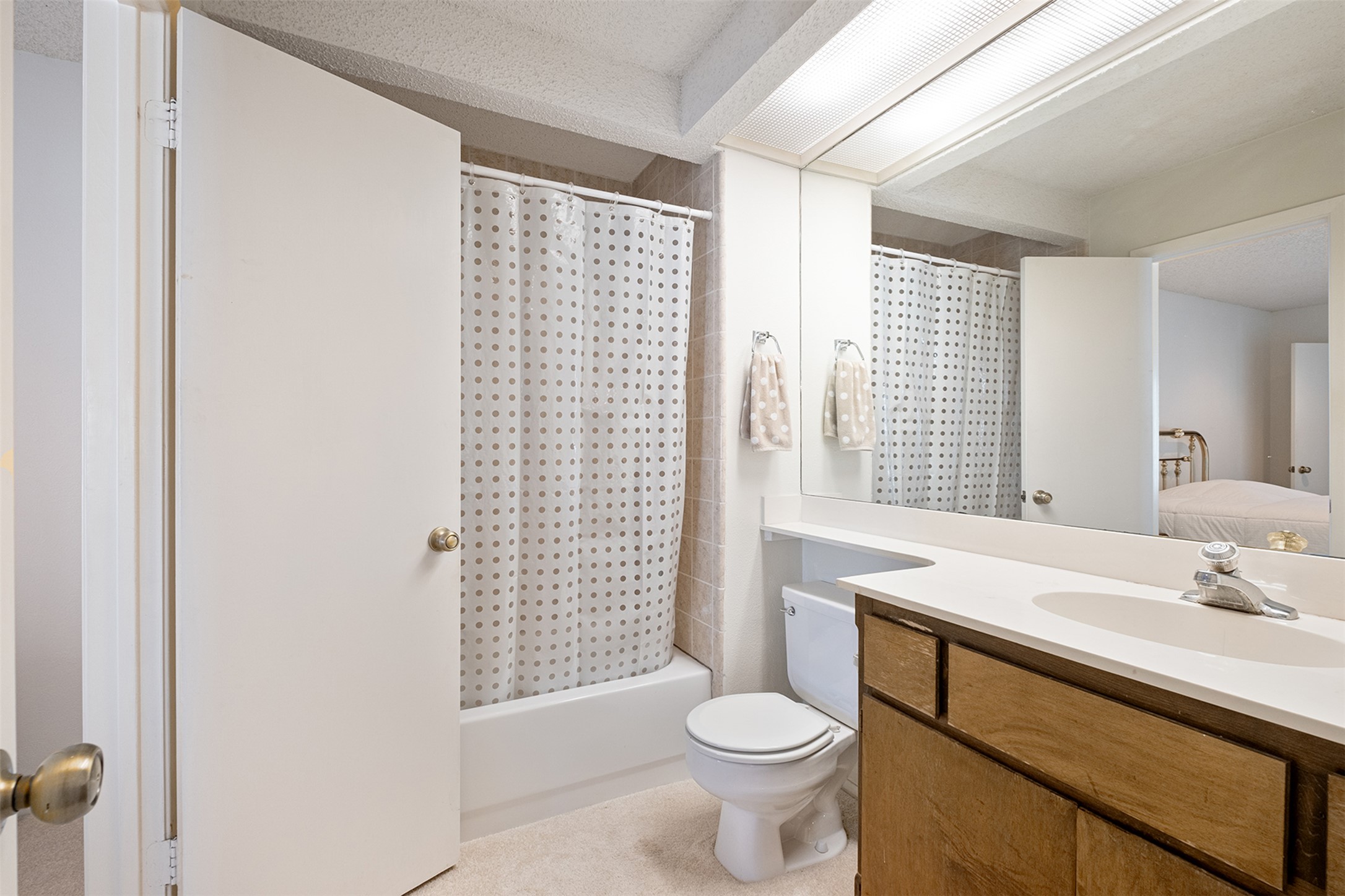 1748 Ohlen Road, Unit 16 Austin, TX 78757 - Photo 17 of 38 Full bathroom with vanity, shower / tub combo with curtain, and connected bathroom