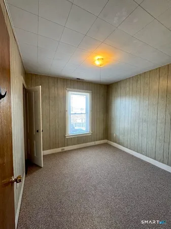 an empty room with a empty space and windows