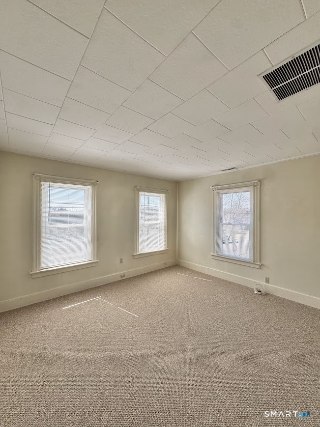 254 Ward Street, Unit 2 Wallingford, CT 06492 - Photo 13 of 28 an empty room with windows