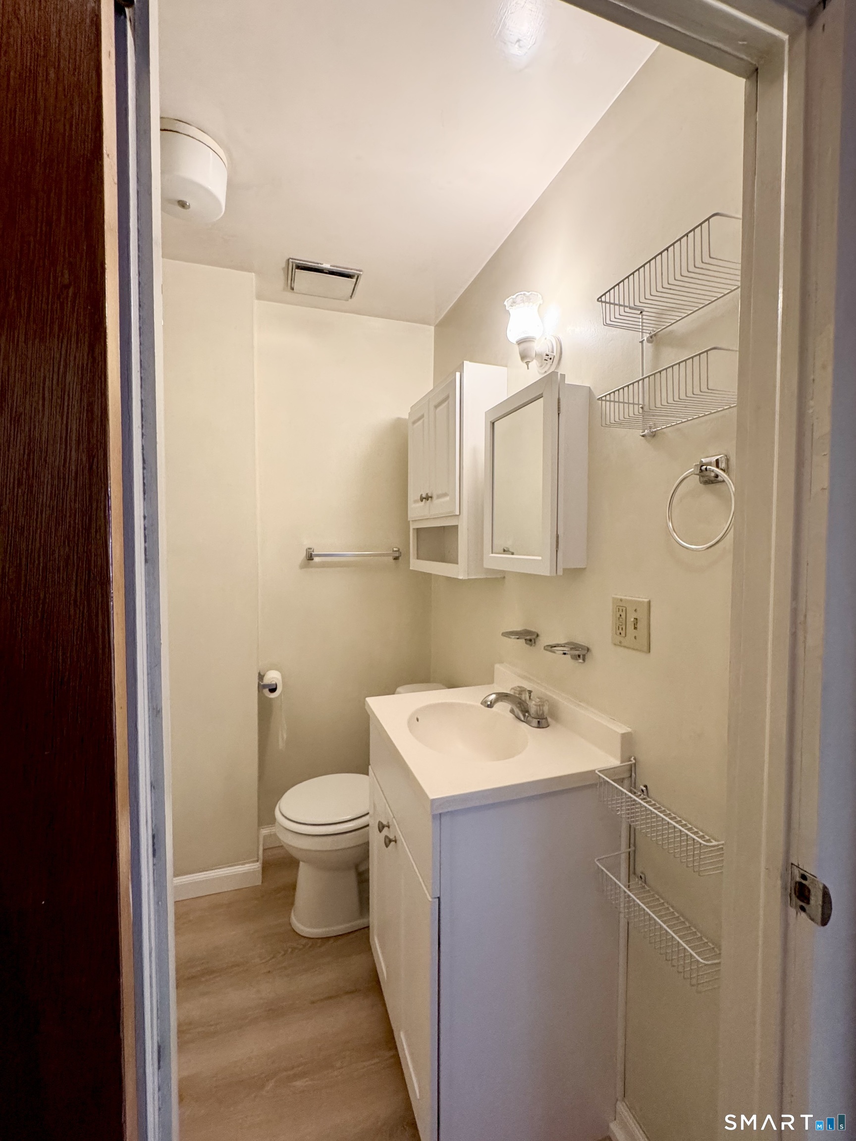 254 Ward Street, Unit 2 Wallingford, CT 06492 - Photo 20 of 28 a bathroom with a sink toilet and shower