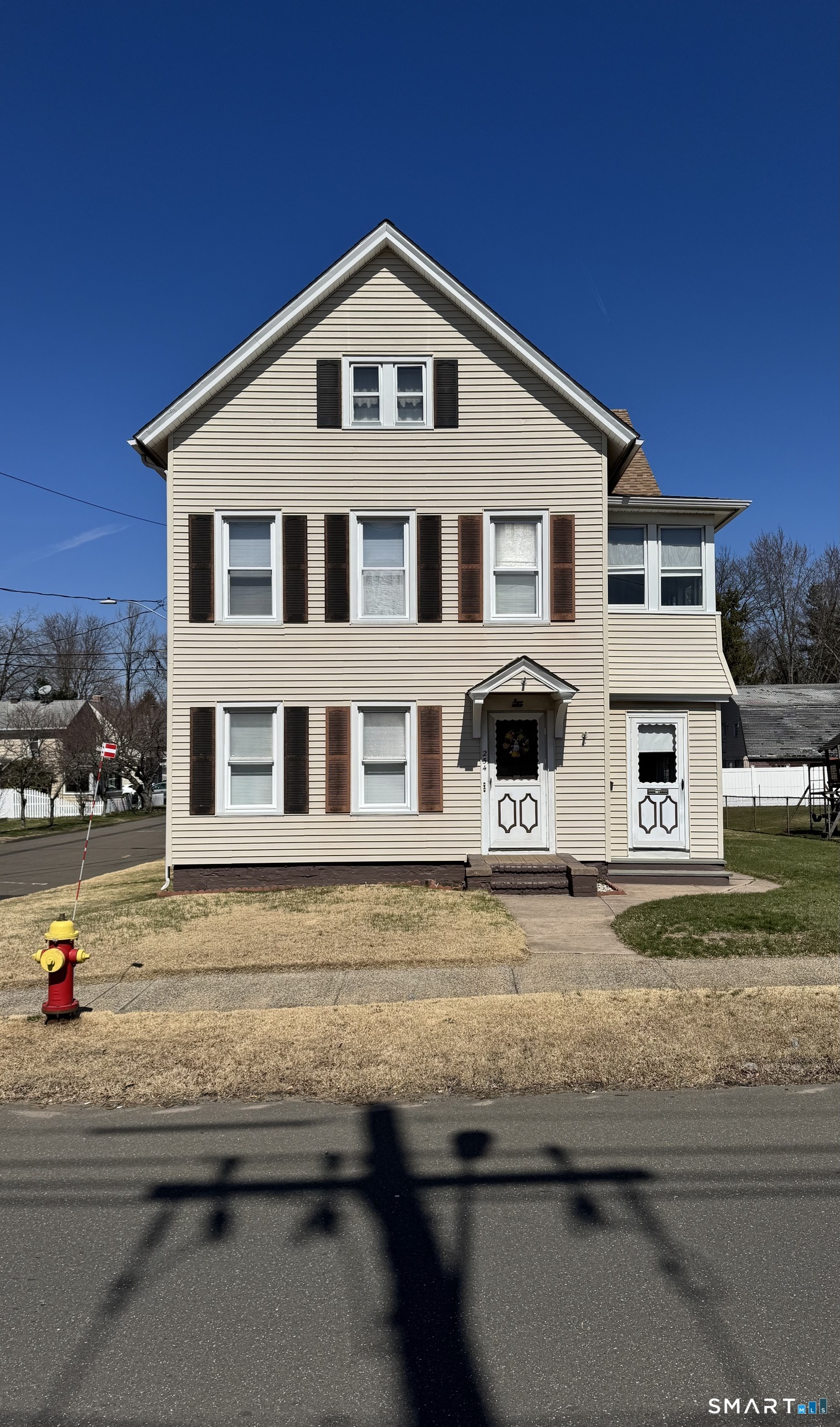 254 Ward Street, Unit 2 Wallingford, CT 06492 - Photo 2 of 28 a front view of a house with a yard