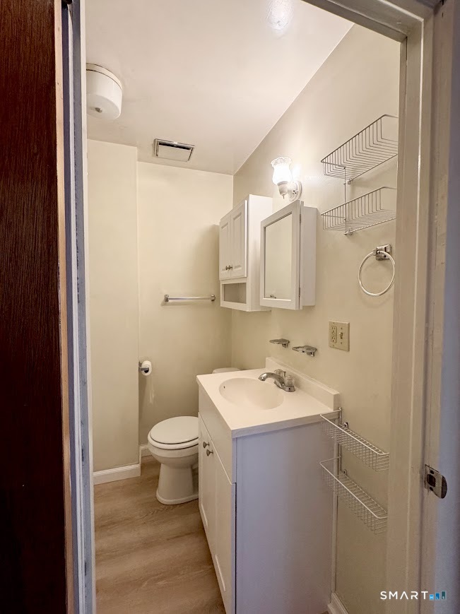 254 Ward Street, Unit 2 Wallingford, CT 06492 - Photo 21 of 28 a bathroom with a sink toilet and shower