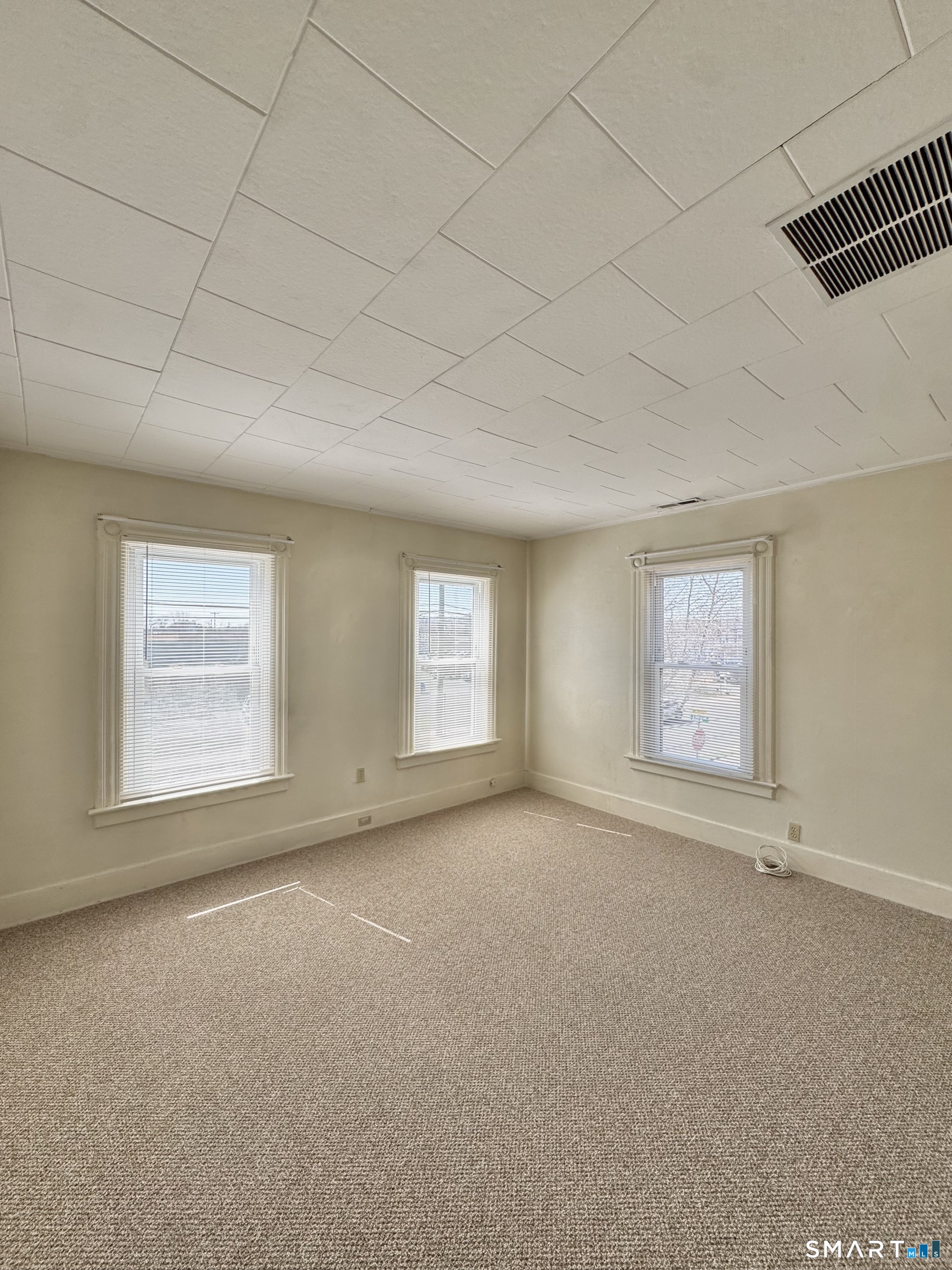 254 Ward Street, Unit 2 Wallingford, CT 06492 - Photo 6 of 28 an empty room with windows